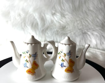 Vintage Japan Lego Tea PotShape Floral & Butterfly Salt And Pepper Shakers.