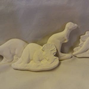 Set of 4  ready to paint  hand poured dinosaurs
