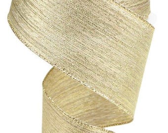 May include: A roll of gold metallic ribbon with a textured woven design. The ribbon has a subtle shimmer and is perfect for adding a touch of elegance to any craft project.