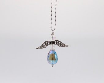 May include: A silver angel charm with iridescent blue crystal wings and a teardrop-shaped crystal pendant.
