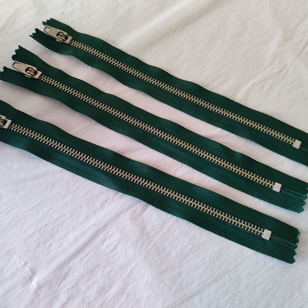 3 Unused Metal Zippers approx 9 inches (22.5 cm) long YKK 1970s on cloth backing good quality stainless steel silver tone on green