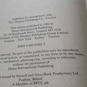 May include: Open book page with text from a 1985 edition. The text includes publishing information, ISBN, and copyright details. The page is off-white with black text.