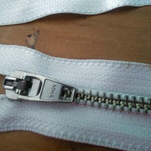 3 Unused Metal Zippers approx 8 inch 1970s YKK  (20cm) long on cloth backing good quality stainless 2 on white