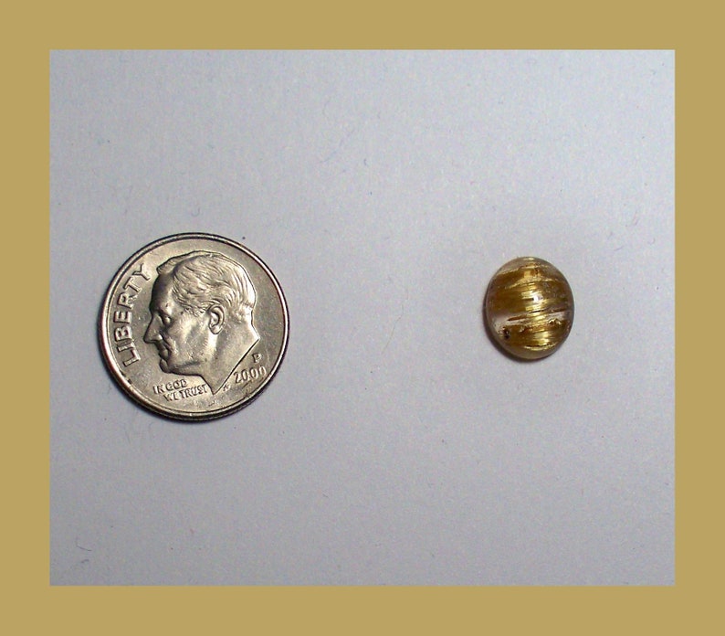 CATSEYE RUTILATED QUARTZ Cabochon \u2013 Unique Rolling Broad Flash Effect \u2013 10 x 8 Millimeter Oval \u2013 Made In Maine