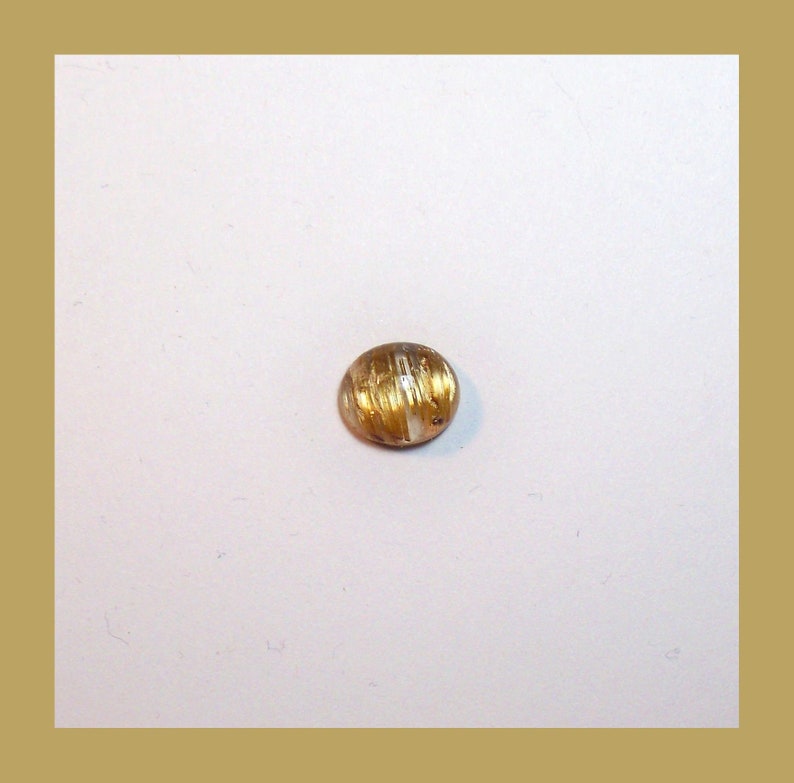 CATSEYE RUTILATED QUARTZ Cabochon \u2013 Unique Rolling Broad Flash Effect \u2013 10 x 8 Millimeter Oval \u2013 Made In Maine
