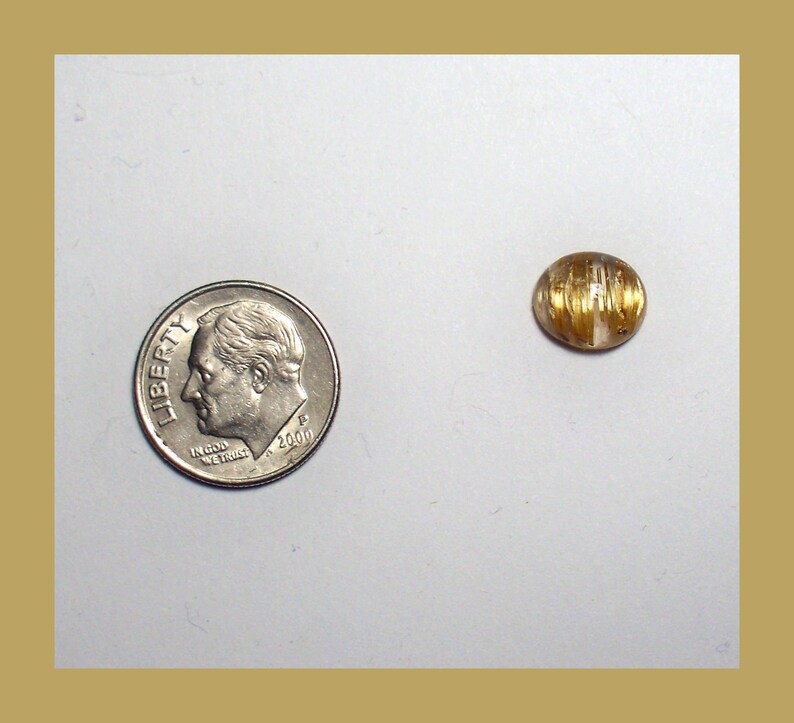 CATSEYE RUTILATED QUARTZ Cabochon \u2013 Unique Rolling Broad Flash Effect \u2013 10 x 8 Millimeter Oval \u2013 Made In Maine