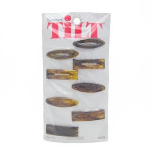 May include: A package of eight brown tortoise shell barrettes with the brand name "Tilt" printed on the front. The package is white with red lettering.