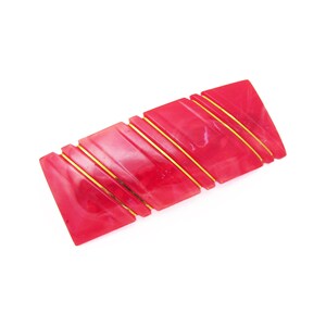 May include: A red and gold striped plastic barrette.