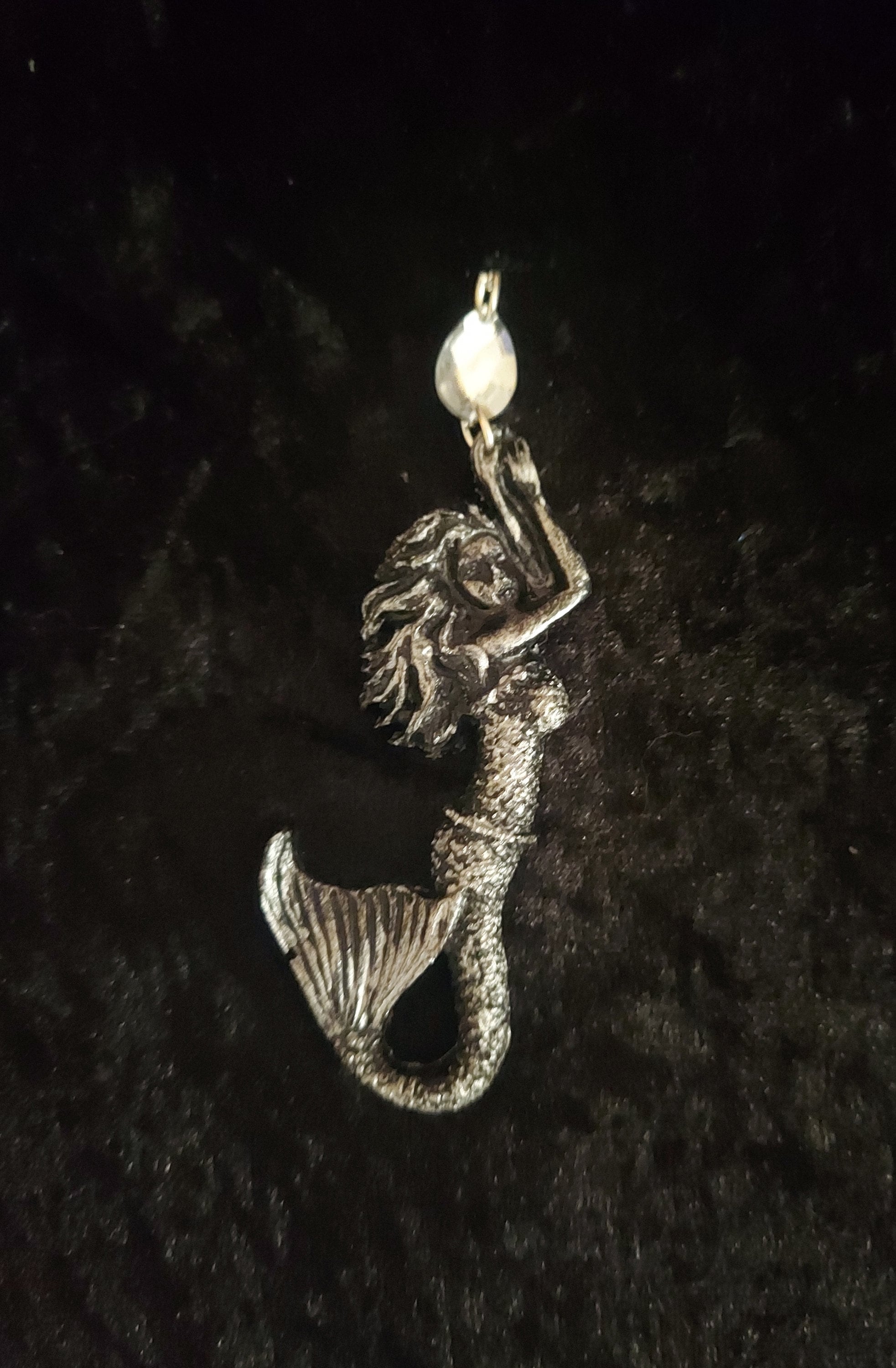 Beautiful 4" mermaid pendant! Hand crafted for your inner mermaid or the mermaid in your life! Metallic looking silver mermaid pendant