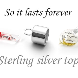 May include: Three silver charm pendants with glass vials. The vials are filled with small, colorful beads and have handwritten messages inside. The text on the image reads "So it lasts forever" and "Sterling silver top".
