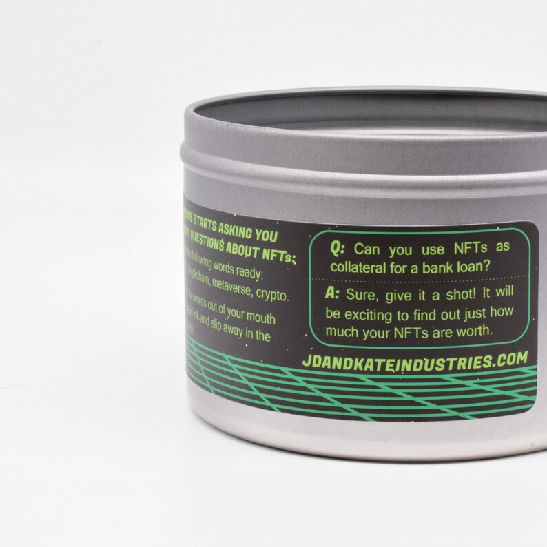 May include: A silver tin with a black and green label that reads "Q: Can you use NFTs as collateral for a bank loan? A: Sure, give it a shot! It will be exciting to find out just how much your NFTs are worth. JDANDKATEINDUSTRIES.COM"