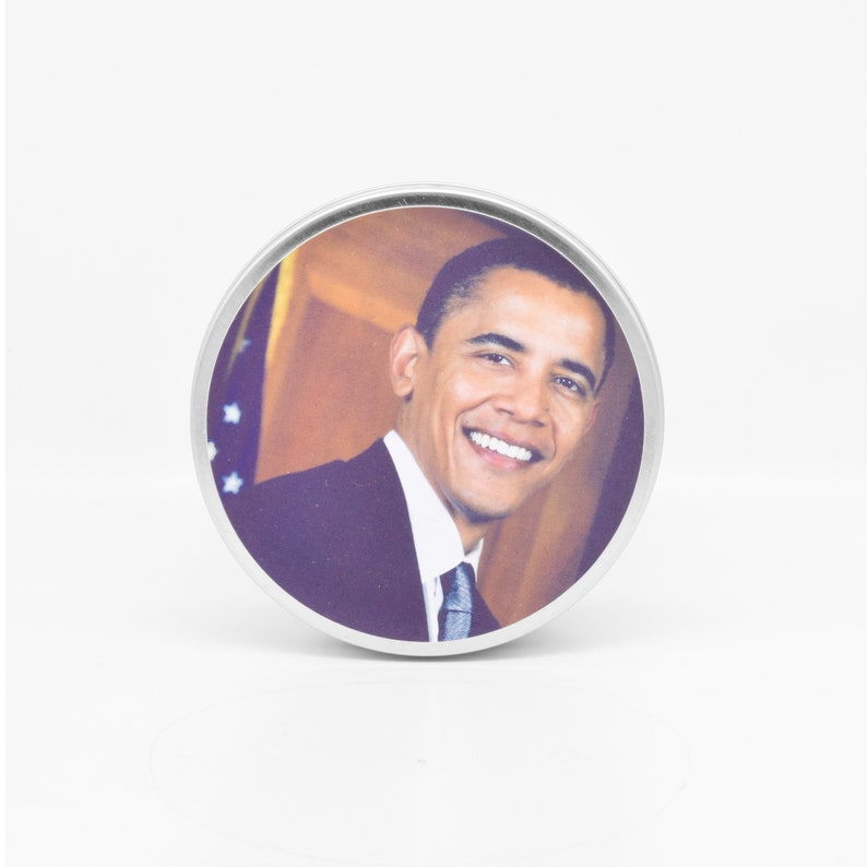 The lid of the Obama Scented Candle features a handsome photo of Barack Obama for you to admire.