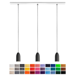 May include: A set of four black pendant lights with a silver track and a variety of colored cords. The cords are available in a range of colors, including red, orange, yellow, green, blue, purple, and white.