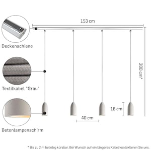 May include: A set of four concrete pendant lights with gray textile cords hanging from a silver track. The lights are 16 inches apart and the track is 60 inches long. The cords are adjustable up to 80 inches.