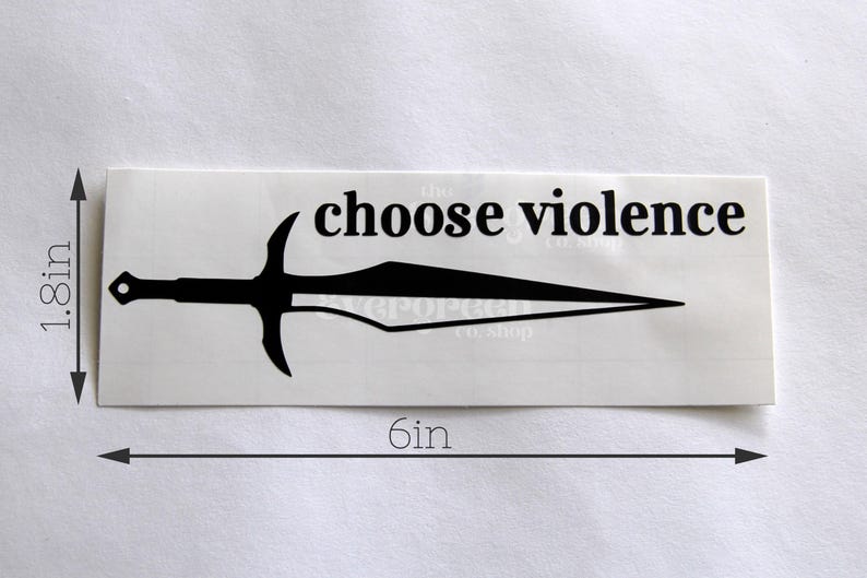 May include: A rectangular sticker with the text "choose violence" above a black sword illustration. The sticker is 6 inches long and 1.8 inches tall. The sticker is on a white background.