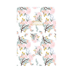 May include: A white notebook with a floral pattern in shades of pink, blue, and yellow. The text "SERMON NOTEBOOK" is printed in gold on the front cover.