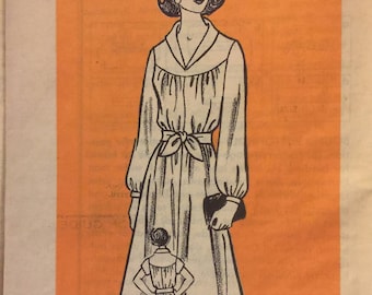 Modèle de vente par correspondance VTG 9415 (début des années 1970). Robe pour femme avec ceinture à nouer.  Taille 12. Complète, non utilisée, FF. Excellent état.
