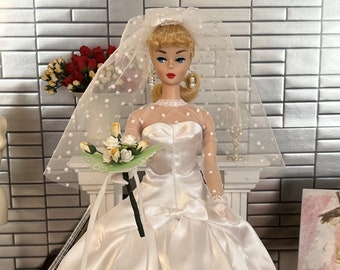 VTG Made-to-Order Reproduction 1967 "Beautiful Bride". Includes:  Wedding gown, underskirt, veil, garter, bouquet, gloves, shoes, earrings.