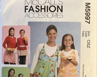 OOP 5720 McCalls (2008). McCalls Fashion Accessories.  Misses' & Girls' Aprons.  Complete, unused, neatly cut (by me).  Excellent condition.