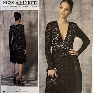 May include: A black lace dress pattern by Nicola Finetti. The pattern includes a knee-length dress with long sleeves and a V-neckline. The pattern size is E5, which fits sizes 14-16-18-20-22. The pattern number is V1471.