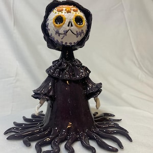 Ceramic Morticia bobble head figurine