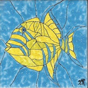 May include: A yellow and blue fish with stripes is painted on a blue tile. The fish is facing left and has a large eye. The tile has a blue background with white speckles.