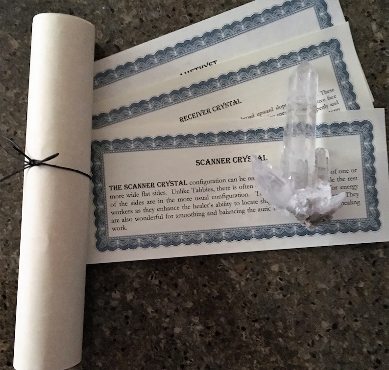 May include: A clear quartz crystal with a certificate that reads "The Scanner Crystal configuration can be more wide flat sides. Unlike Tabbies, there is often of the sides are in the more usual configuration. Workers as they enhance the healer's ability to locate sh are also wonderful for smoothing and balancing the auric work."