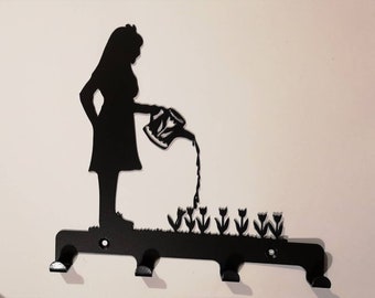 Woman watering flowers Key holder hooks