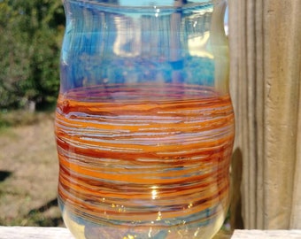 Hand blown glass drinking cup.