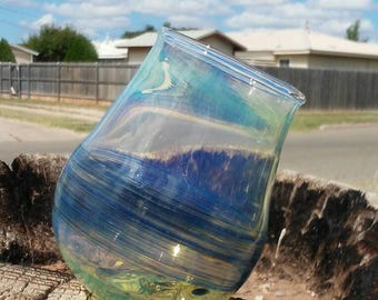 Tilted stemless wineglass with silver fume and color trailing