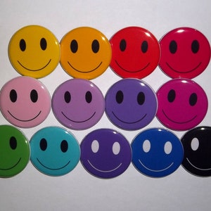 May include: A set of 12 smiley face buttons in various colors, including yellow, orange, red, pink, purple, blue, green, and black.