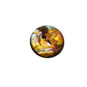 May include: A round button with a glossy, iridescent finish featuring swirling patterns of amber, gold, and dark brown tones. The button has a recessed center with two holes for attachment, displaying a reflective, polished surface texture.