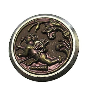 May include: A round, silver-toned button with a raised design of a cherub holding a bow and arrow. The cherub is surrounded by a floral design in shades of purple and brown.