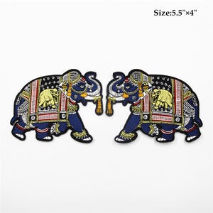 May include: Two embroidered iron-on patches of blue elephants with colourful patterns, each measuring 14 cm by 10 cm. Size: 5.5" x 4"