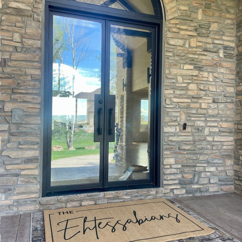 May include: A brown doormat with the text "THE Thessalonians" in black cursive lettering.