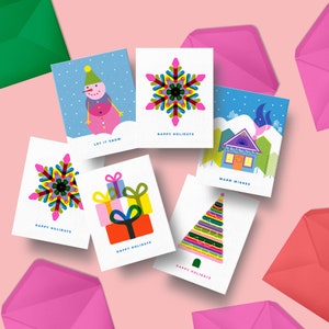 Caja de tarjetas de felicitación variadas, risografía, Navidad, vacaciones, colorido, festivo, divertido, copo de nieve, muñeco de nieve, árbol, cabaña, regalos, obsequios,