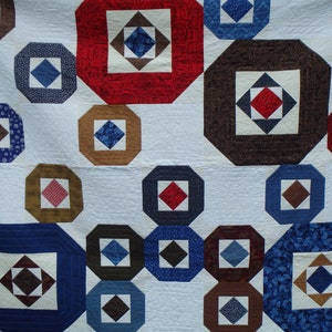 modern queen size red, blue and brown quilt image 2