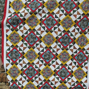 green, red and yellow queen size quilt