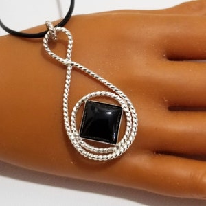 az0166- Sterling Silver, Symbol In Tear Drop Twisted Pendant . Twisted Sterling Silver Wire Hand Crafted