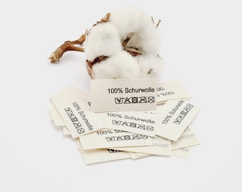 50 textile labels made of natural cotton ribbon with the inscription 100% virgin wool