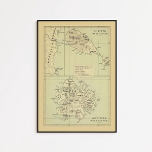 Op de afbeelding: Een ingelijste vintage-stijl kaartafdruk met twee afzonderlijke geografische kaarten van St. Kitts en Antigua in West-Indië. De kaart heeft een gedempte beige achtergrond met zwarte inktlijnen, labels en tekst die eilanden en steden beschrijven.