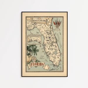 Puede incluir: Mapa vintage enmarcado de Florida, con ilustraciones detalladas de lugares emblemáticos. El mapa está en un marco negro con un borde color crema. La palabra "FLORIDA" se muestra en una pancarta en la parte inferior del mapa.