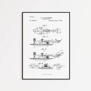 May include: Framed patent illustration of a telegraph key by J. B. Van Deusen, patented August 5, 1890. The black and white drawing shows several views of the device, including a top-down view and side profiles. The frame is black.