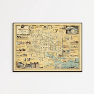 May include: A framed historical map of old Baltimore with a cream-colored background, black grid lines, and various illustrations of buildings, ships, and people. The title reads Historical Map of Old Baltimore Published by the Savings Bank of Baltimore.
