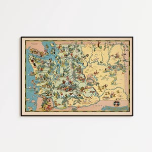 May include: A framed vintage map of Washington State, featuring a colorful, illustrated style. The map includes whimsical drawings of landmarks and activities, with a black frame. The word "WASHINGTON" is visible.