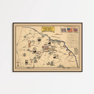 May include: A framed historical map of Rowan County, North Carolina, printed on tan paper. The map features black ink illustrations, text labels, a compass rose, and three small flags in the upper right corner, all enclosed in a thin black frame.