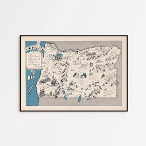 May include: A framed map of Oregon, with a detailed illustration of the state's geography. The map includes the names of cities like Portland, Salem, and Eugene. The artwork is in shades of grey, blue, and white, with a black frame.