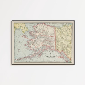May include: A framed vintage map of Alaska featuring distinct red boundary lines for the 1st, 2nd, 3rd, and 4th Judicial Divisions. The map displays geographical details of the region, including the Bering Sea, with text labels for each division.