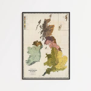 May include: Framed vintage map of Great Britain and Ireland, featuring a detailed geographical representation with various color-coded regions. The map is enclosed in a black frame, suitable for home decor.