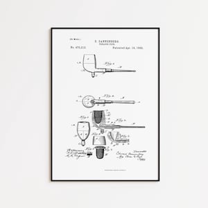 May include: Black and white framed print of a tobacco pipe patent illustration. The print includes detailed diagrams and text, including the name E. Dannenberg and the patent date of April 19, 1892. The frame is black.